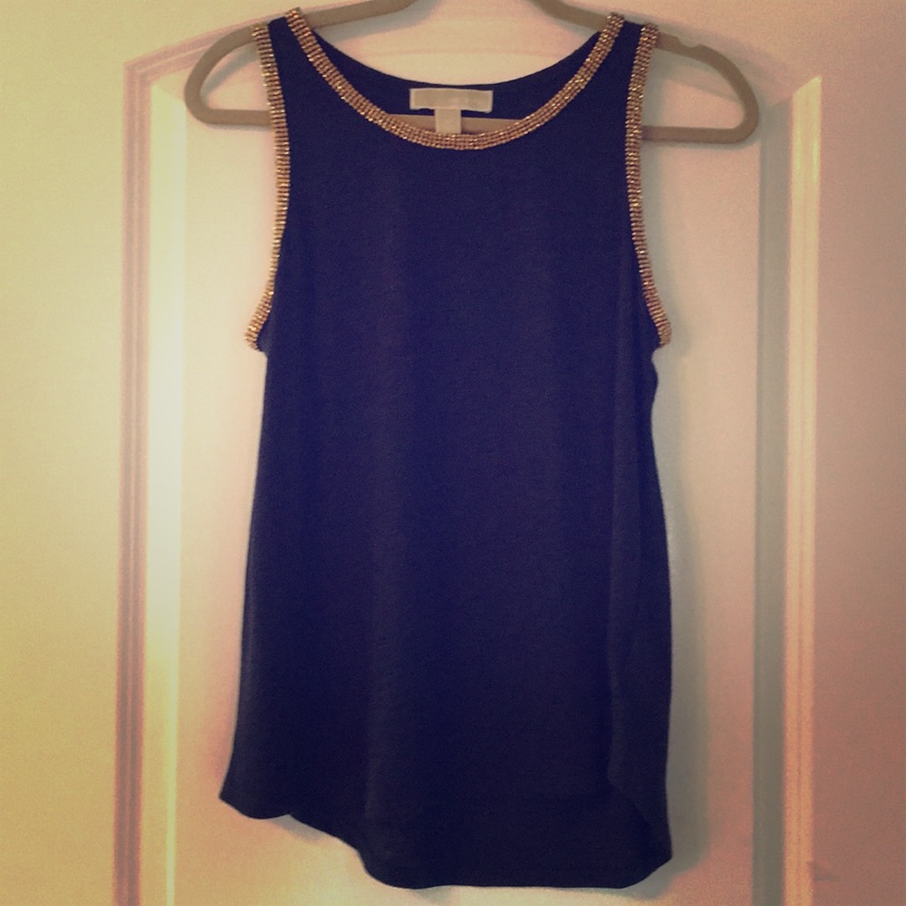 Navy top with gold along neck and sleeve line.